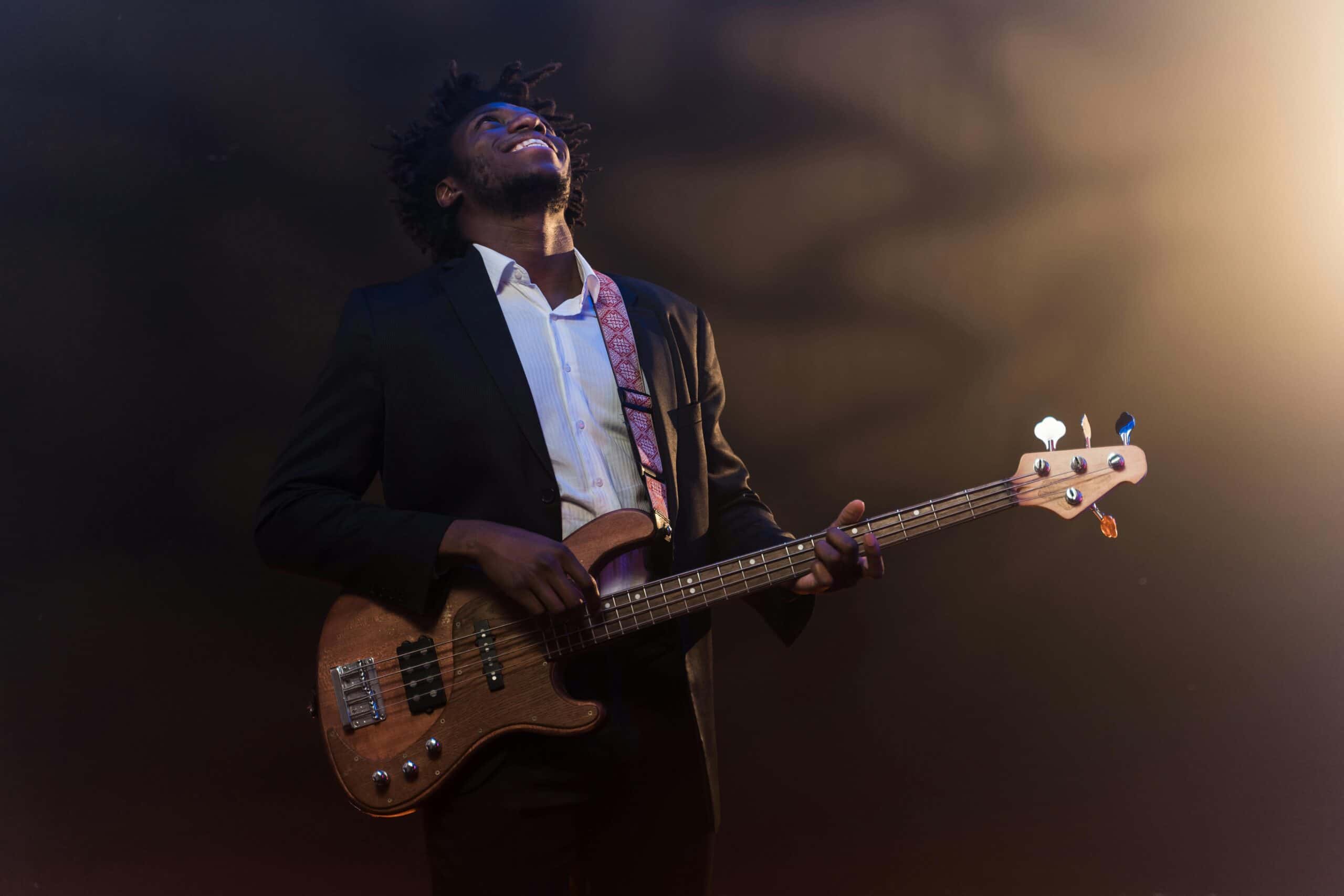 Man enjoying himself playing bass guitar
