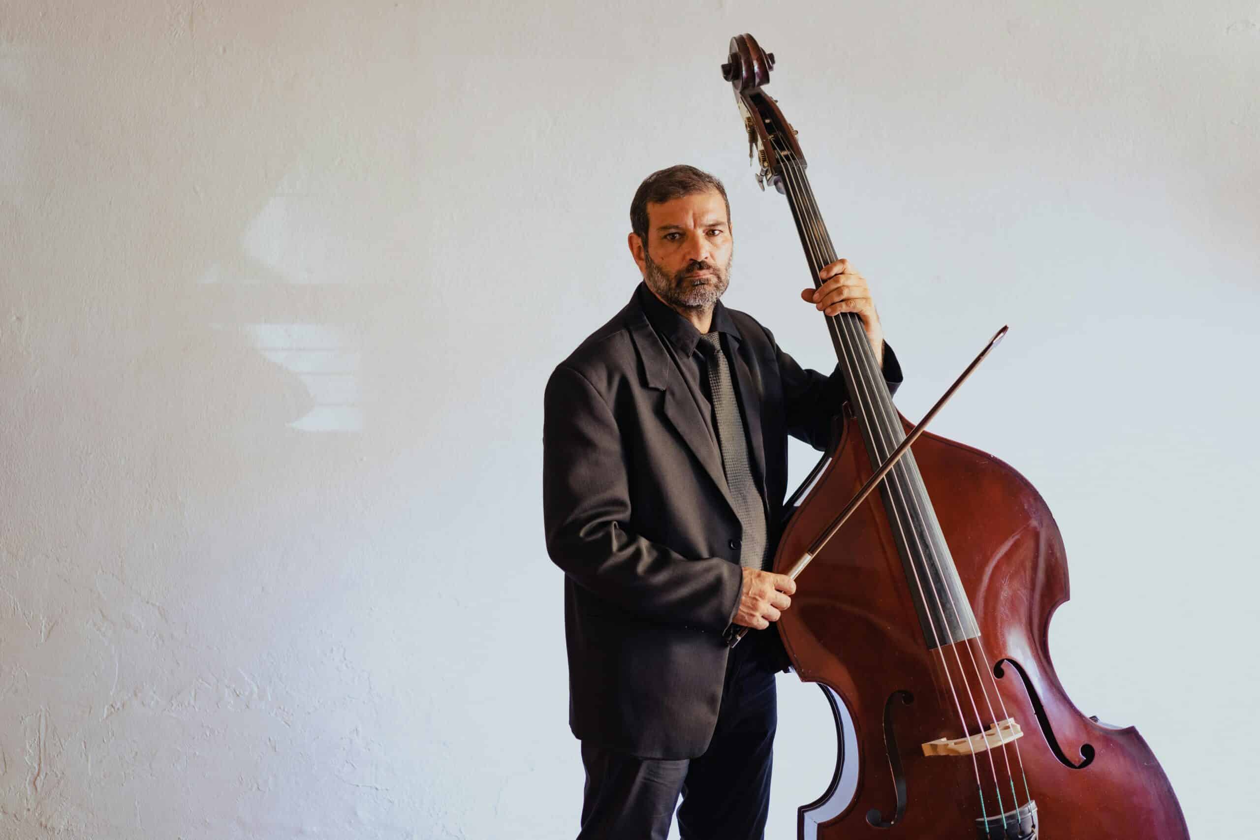 Man standing next to double bass