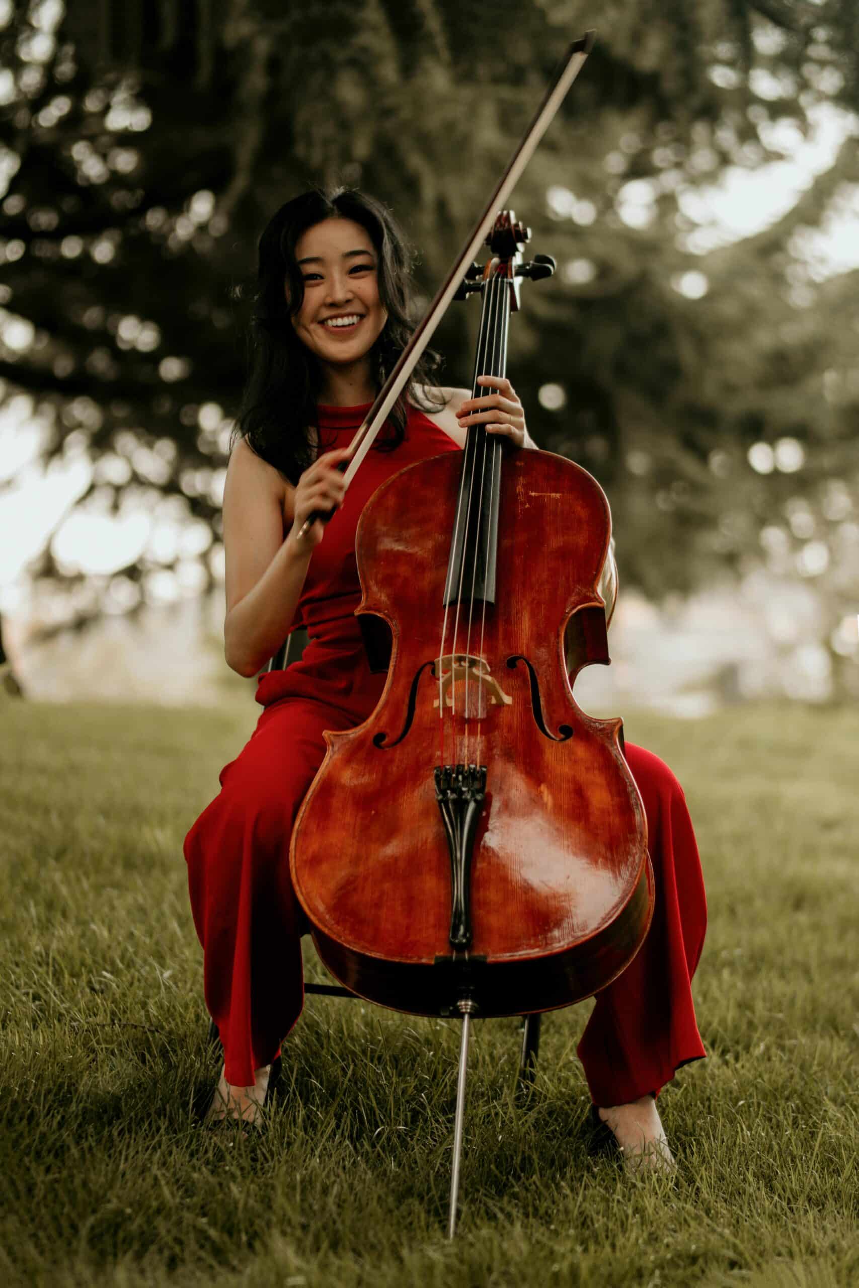 Woman with cello in park