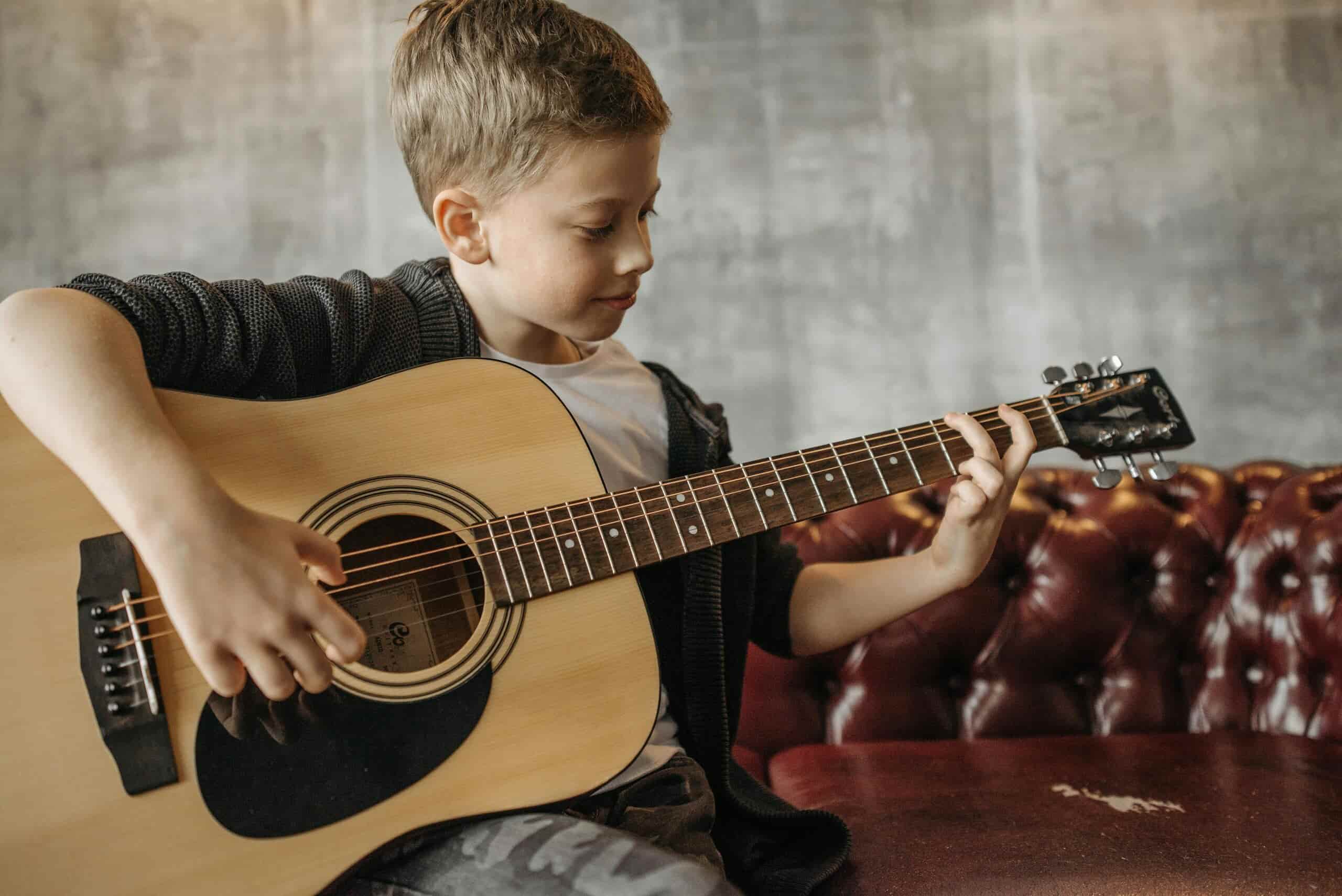 Boy having fun playing guitar