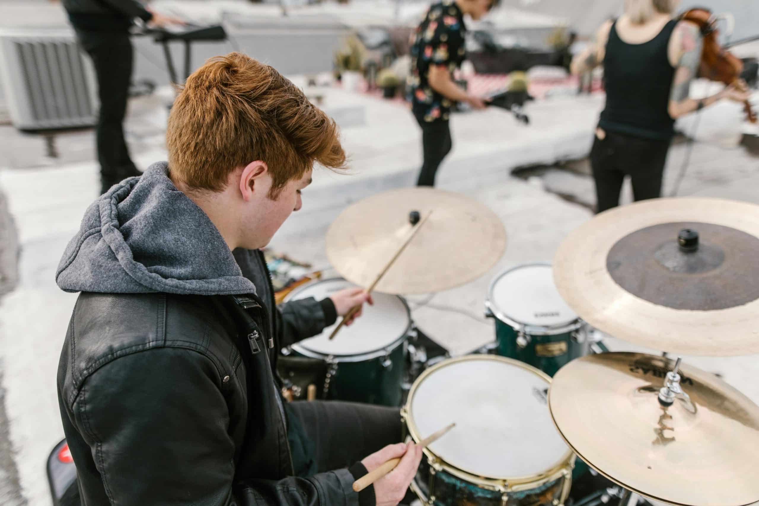 Man looking at his drumset