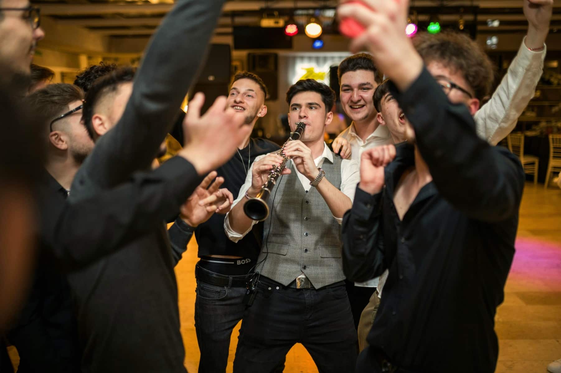 Clarinet player with group of boys around him