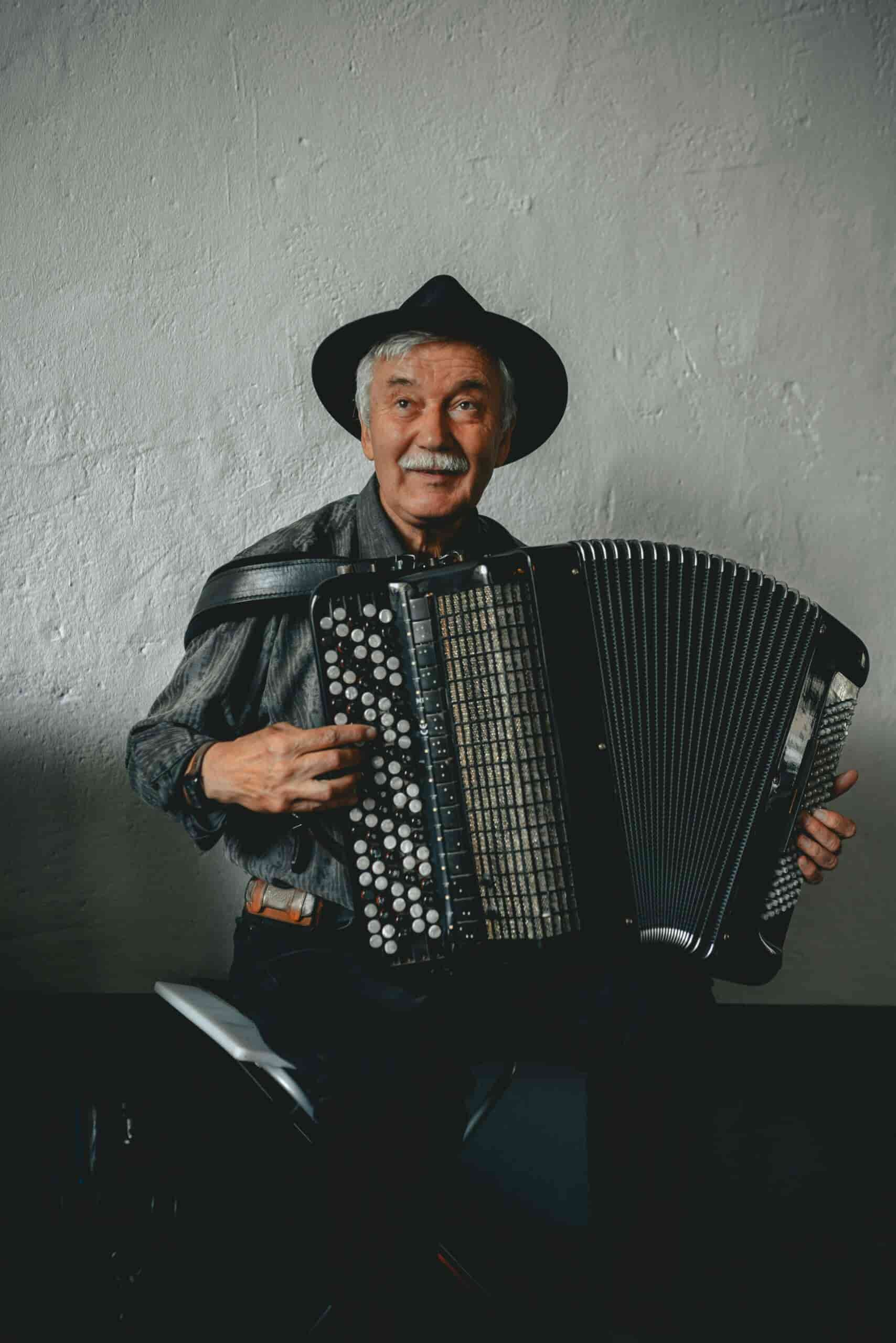 Old man playing button accordion