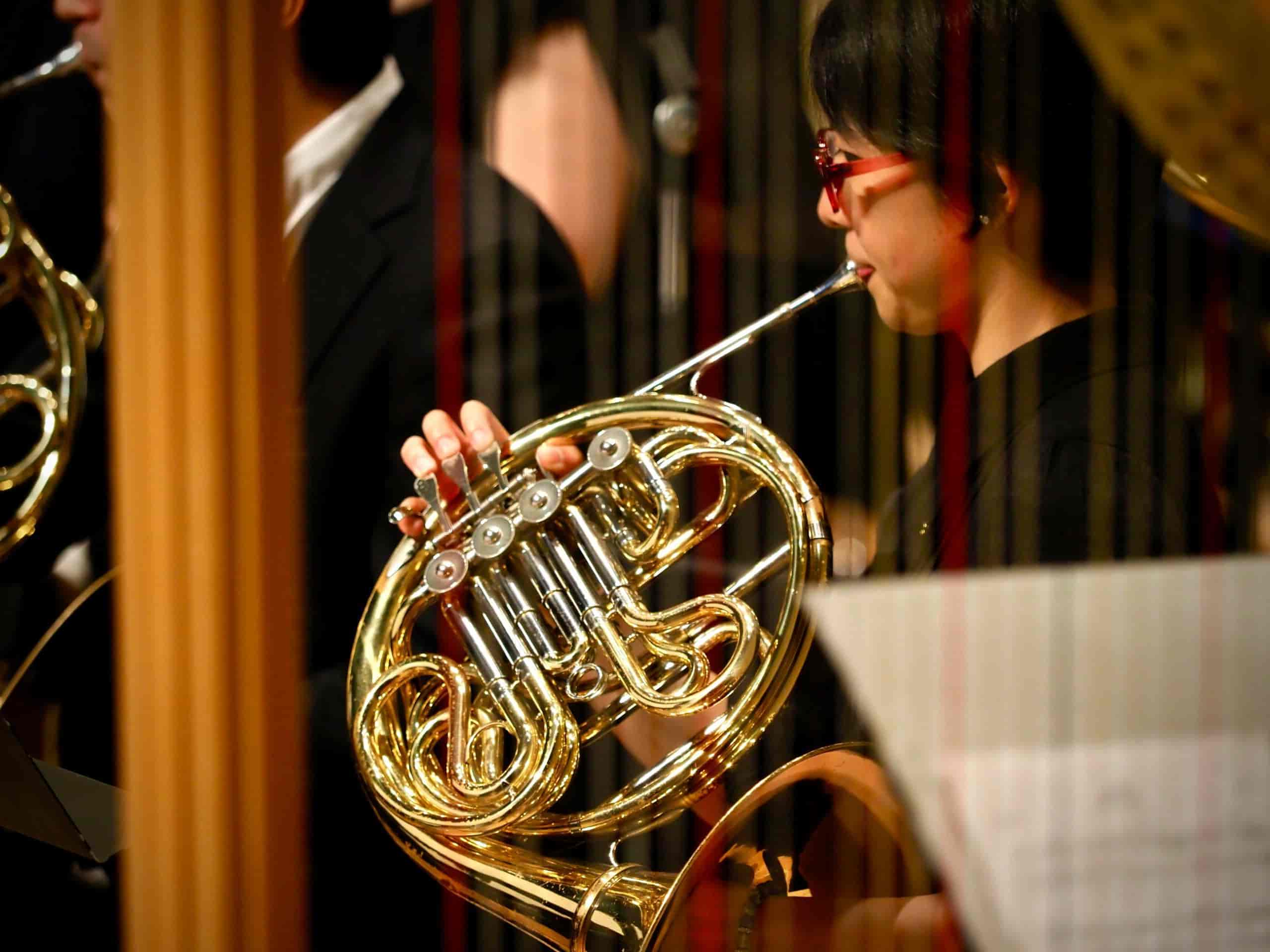 Woman playing french horn