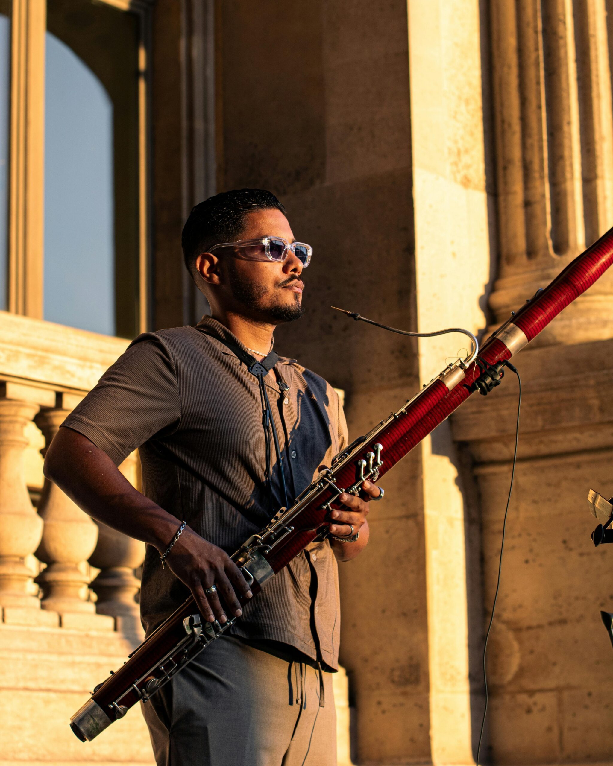 Man in sunset playing bassoon