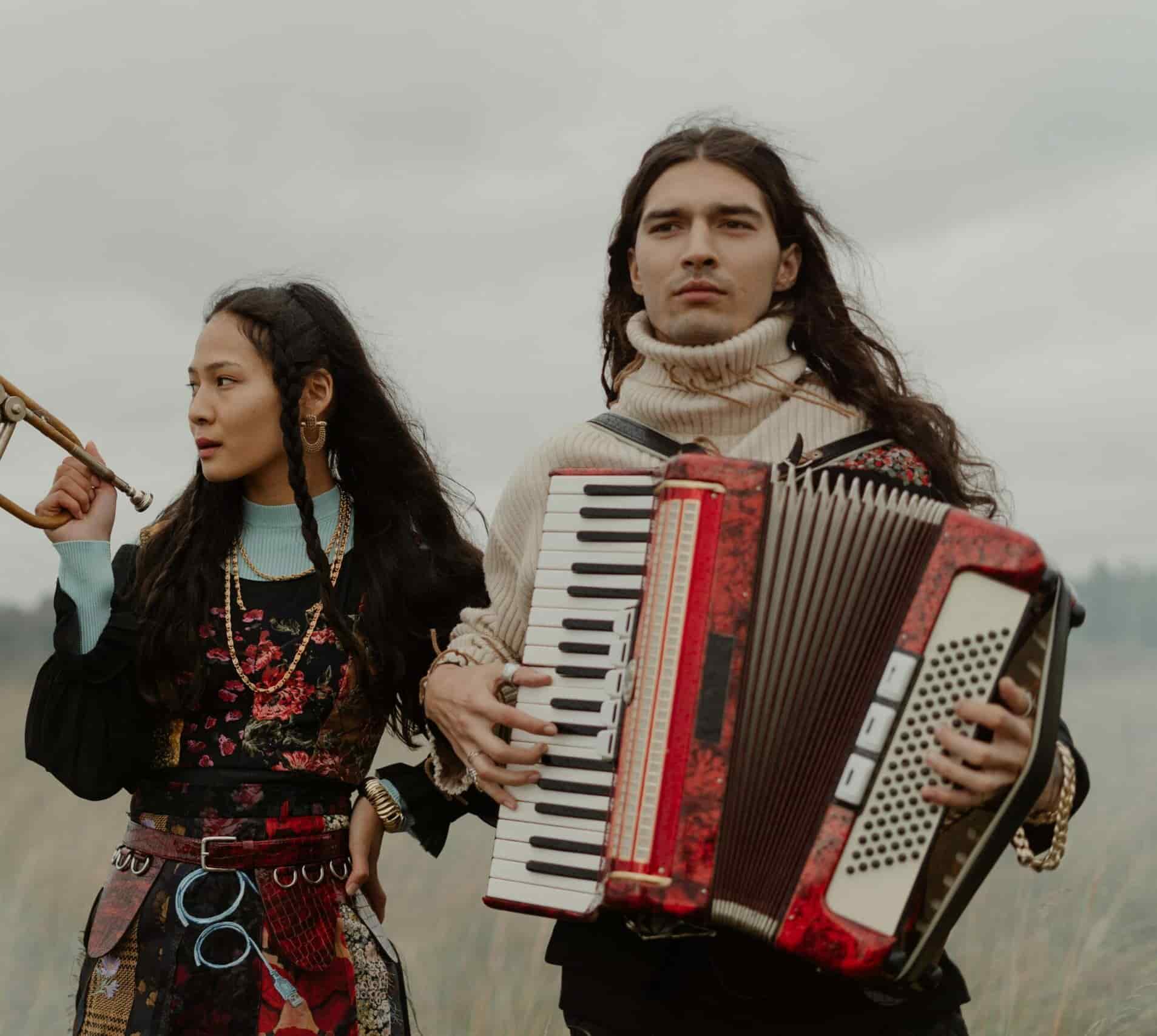 Accordion player and trumpetist in a field