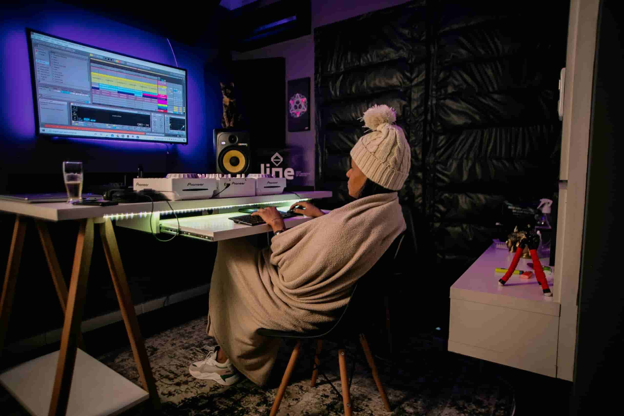 Girl taking music production lessons online
