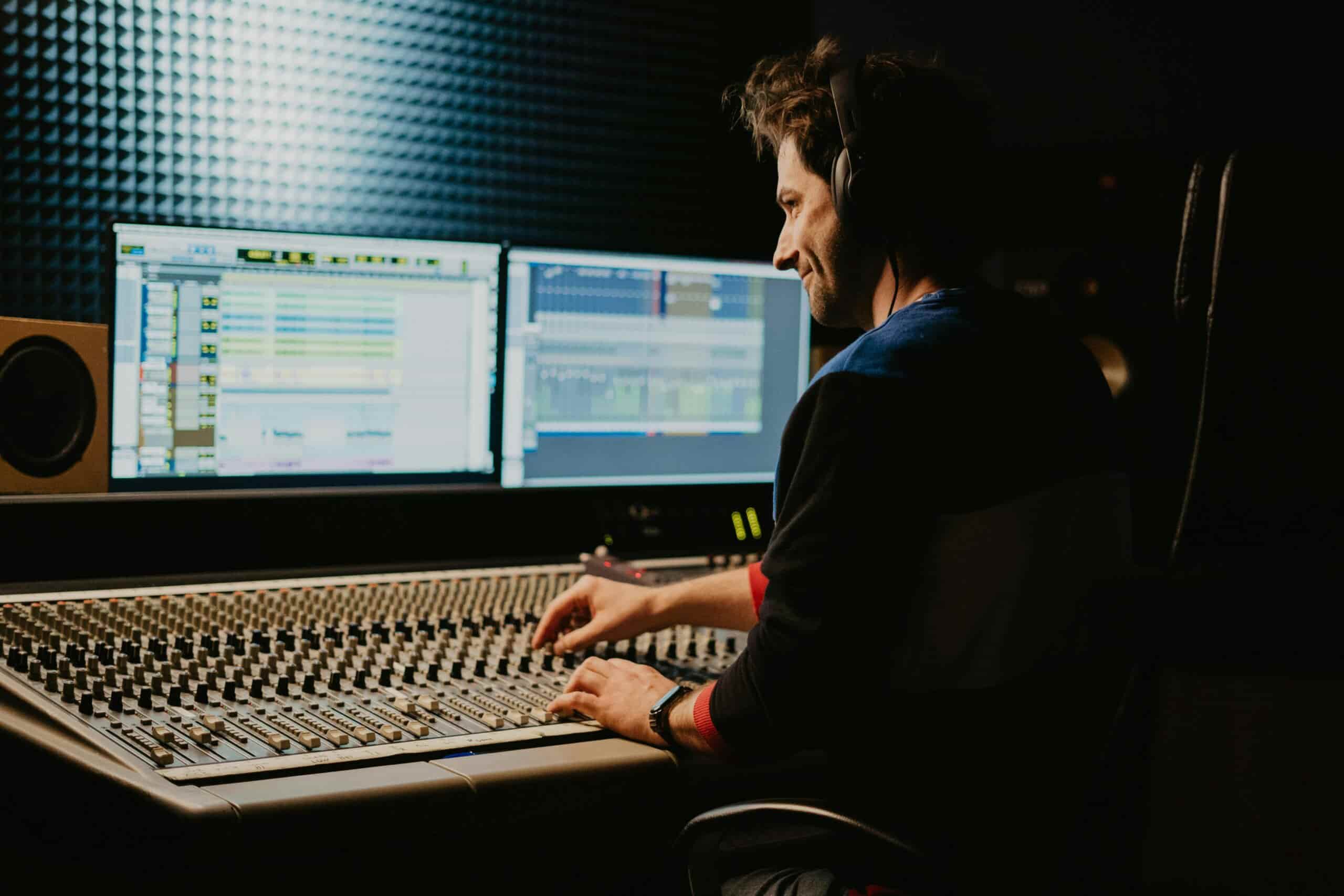 Man in studio using Logic Pro