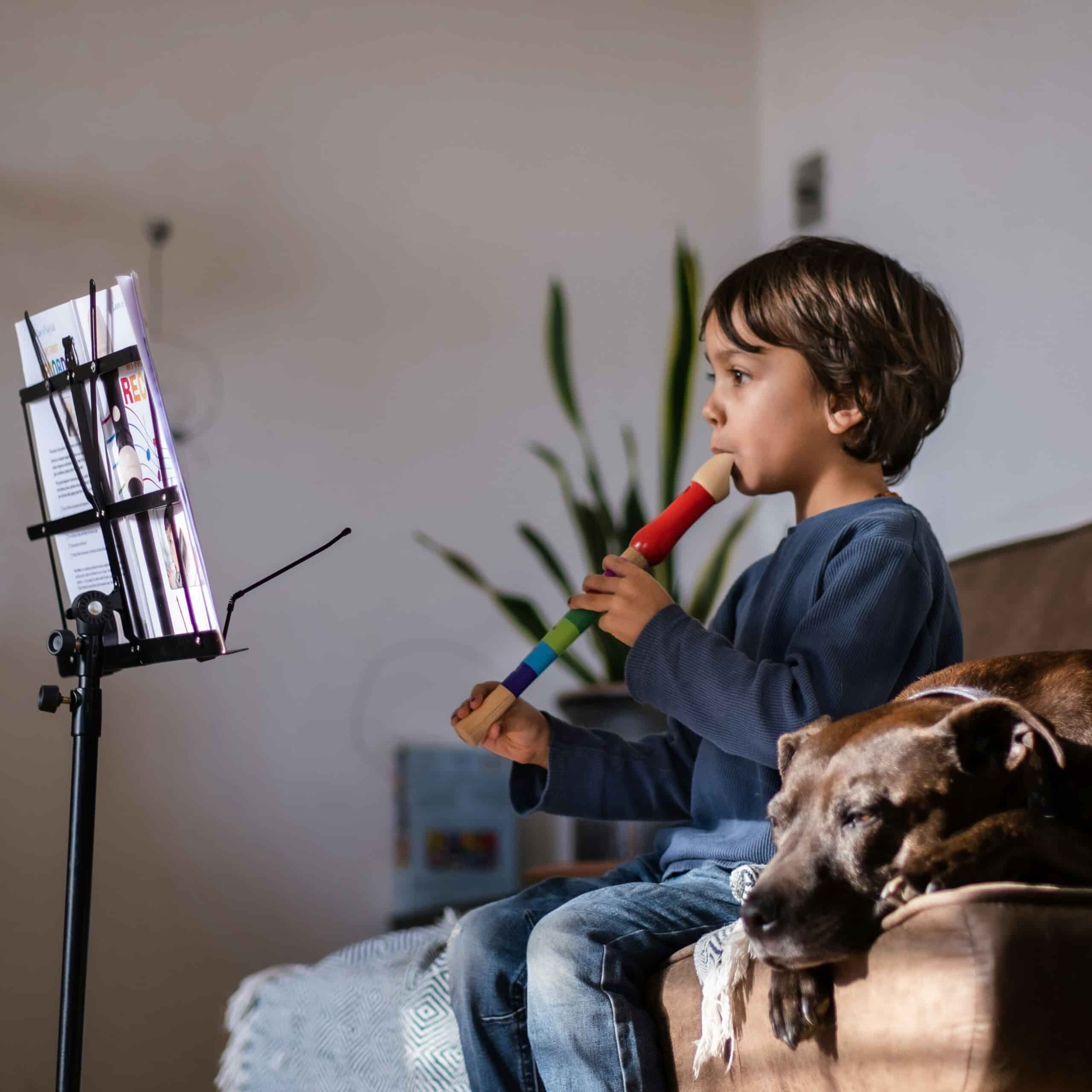 Kid taking recorder lessons