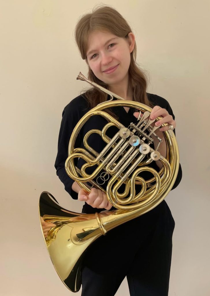Emily, french horn, trumpet, baritone, and music theory teacher