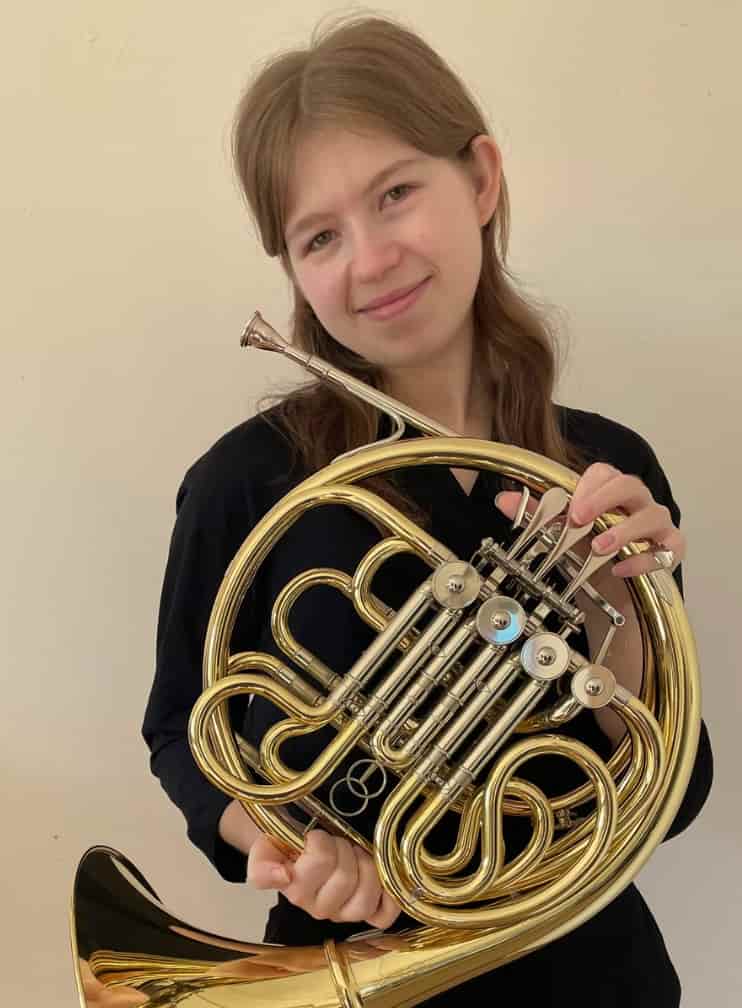 Emily, french horn, trumpet, baritone, and music theory teacher