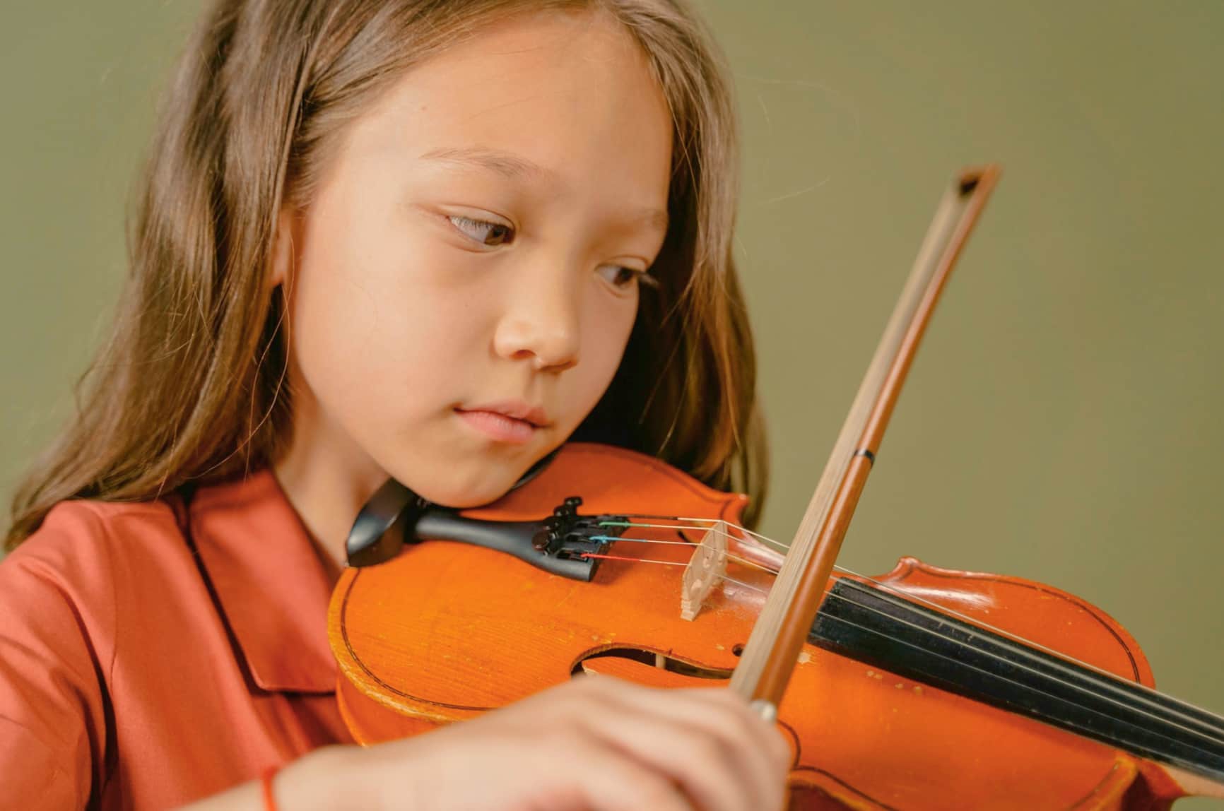 Close up of girl playing violin