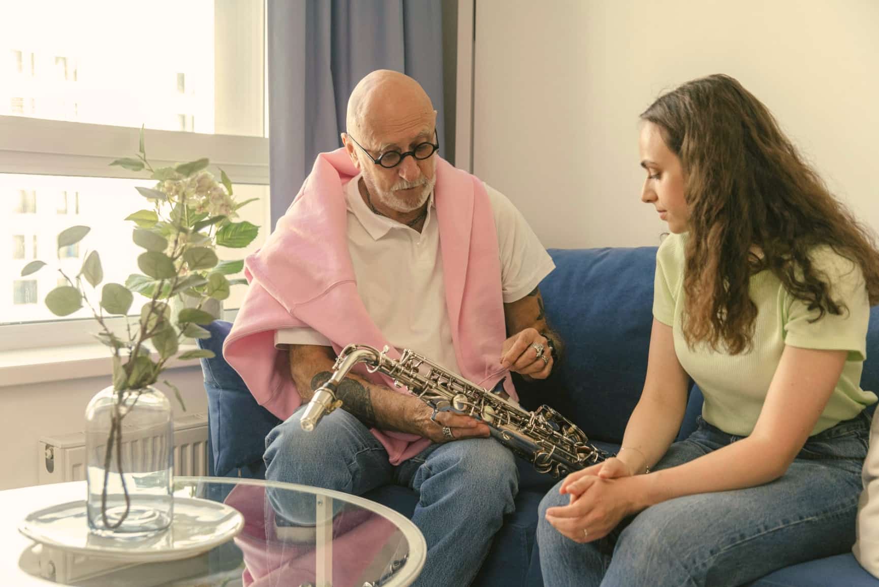 Saxophone teacher teaching woman during saxophone lessons