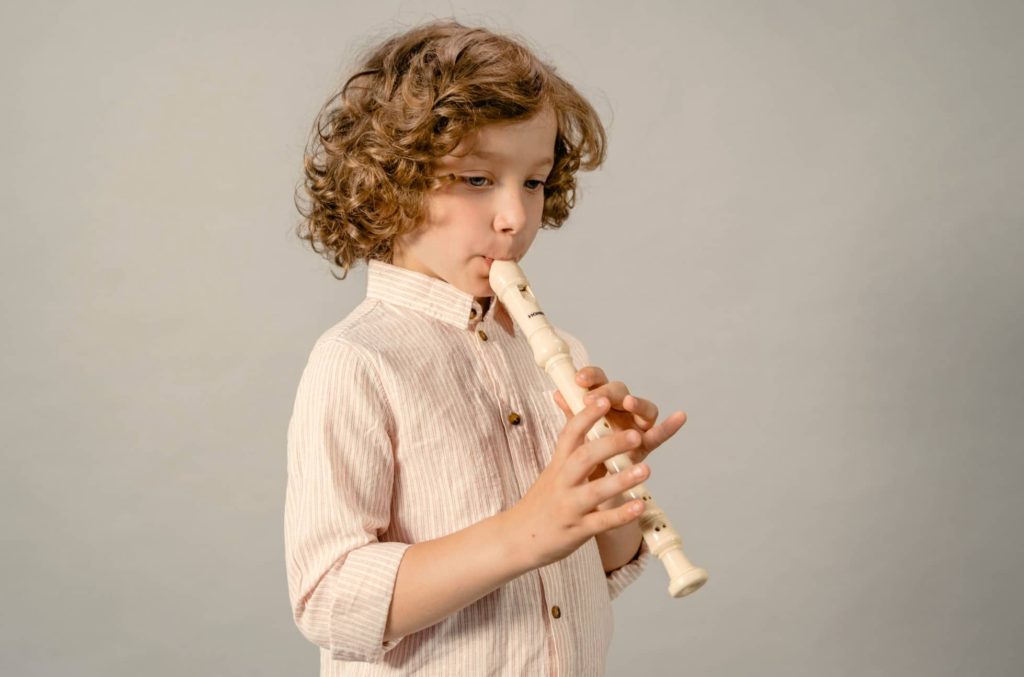 Kid playing recorder