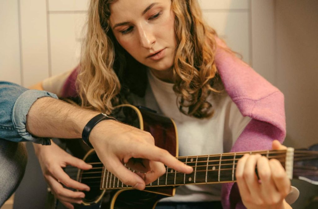 Guitar student in guitar lessons