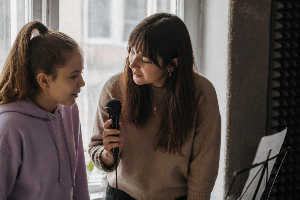 Singing teacher with student in singing lessons