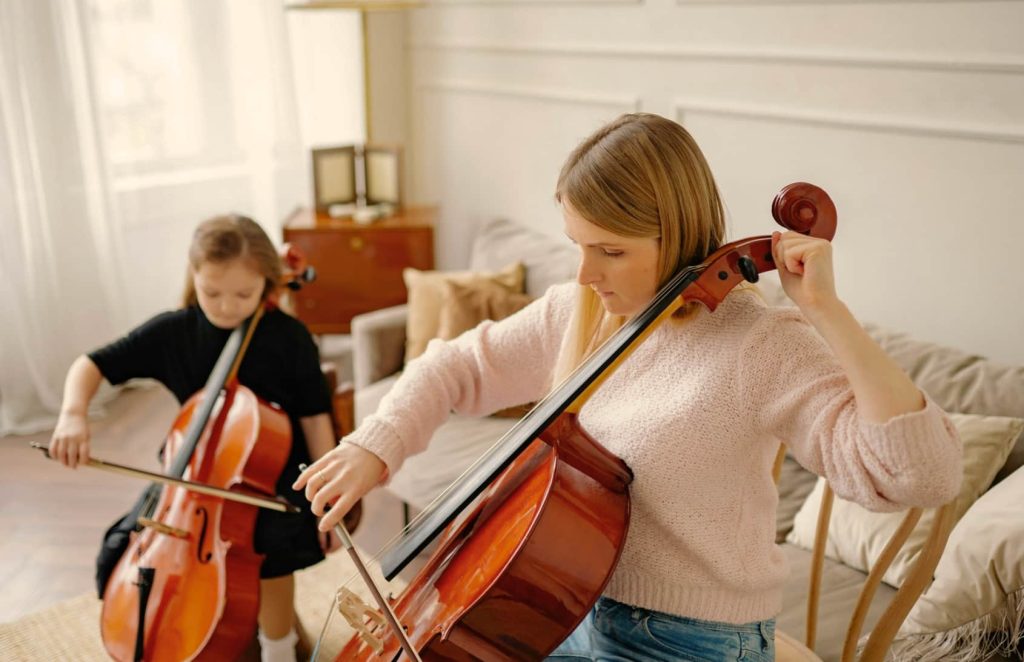 Cello teacher with student in cello lessons