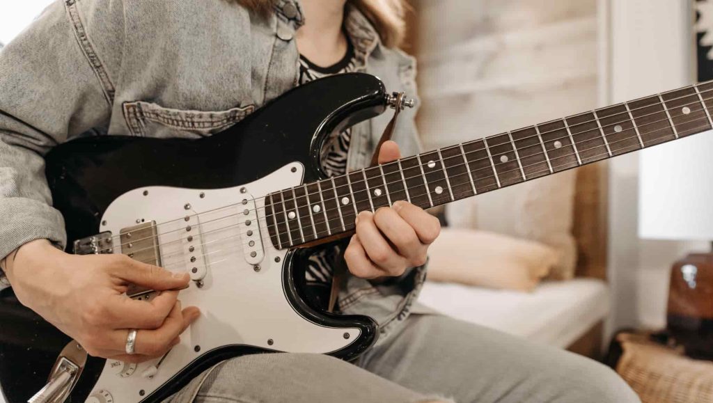 playing electric guitar