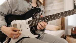 playing electric guitar
