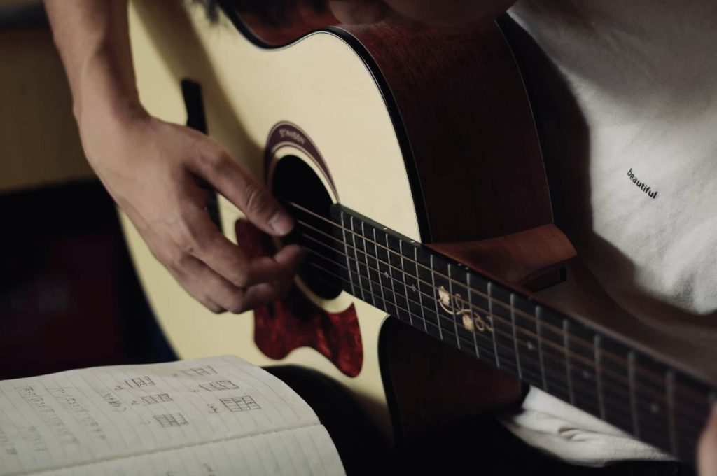A man is playing guitar