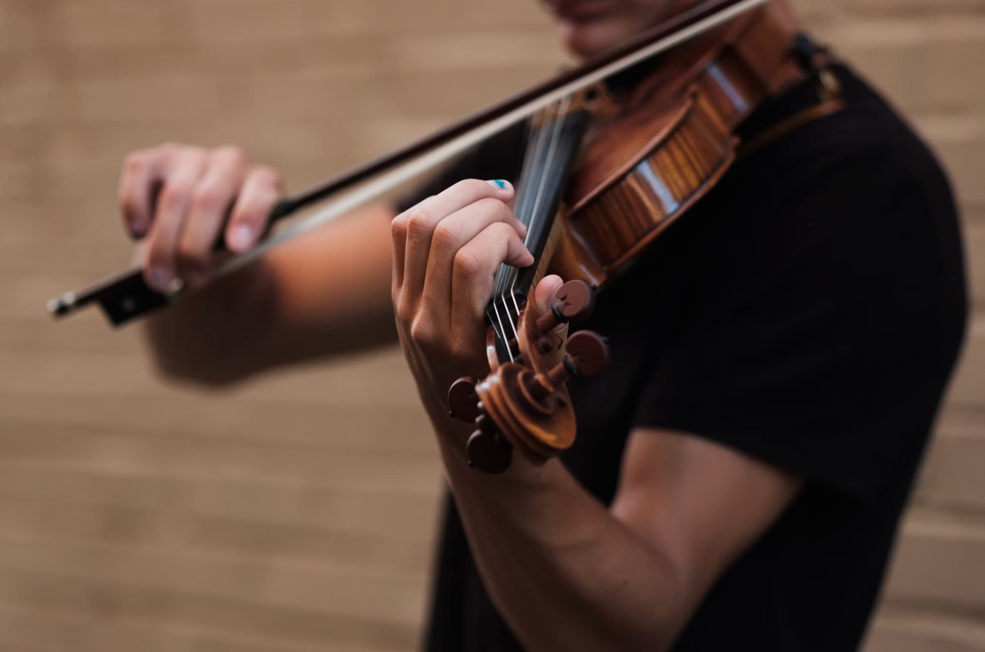 A guy is playing violin