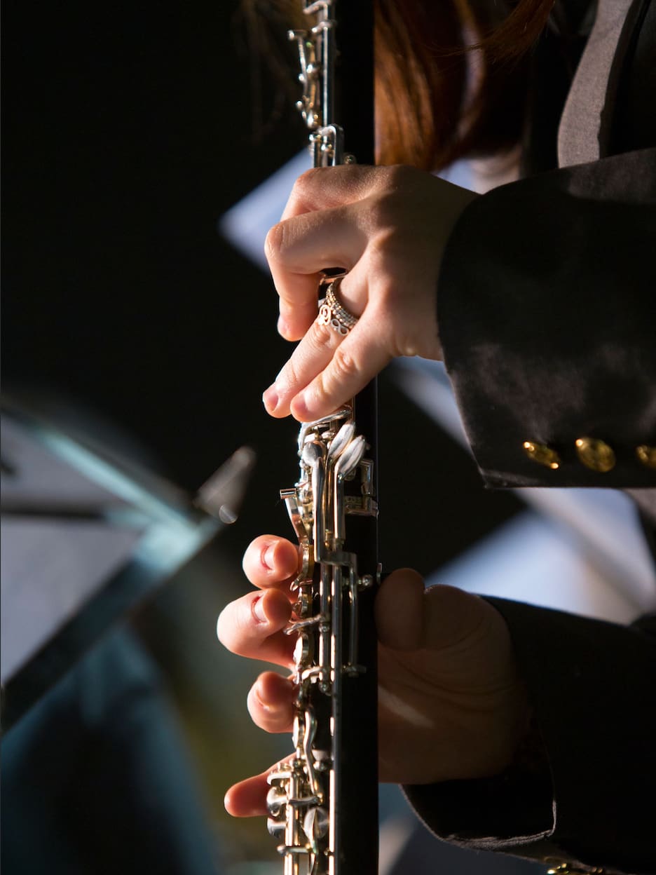 holding clarinet