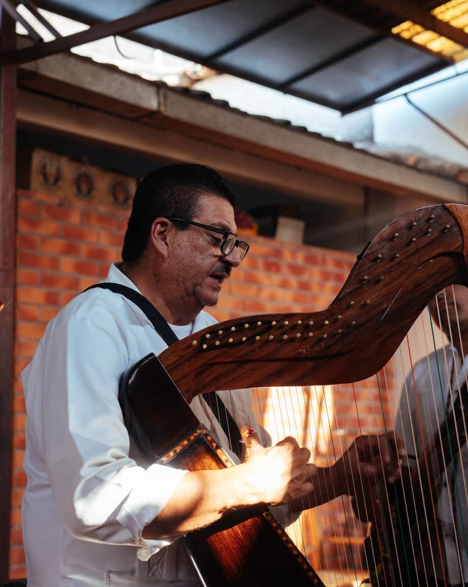 man playing harp