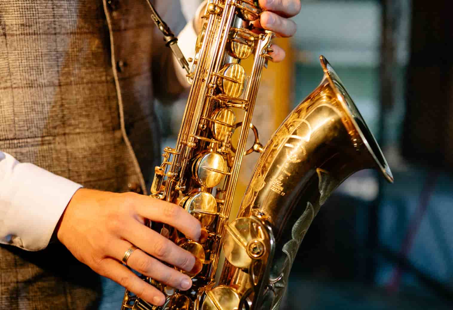holding saxophone